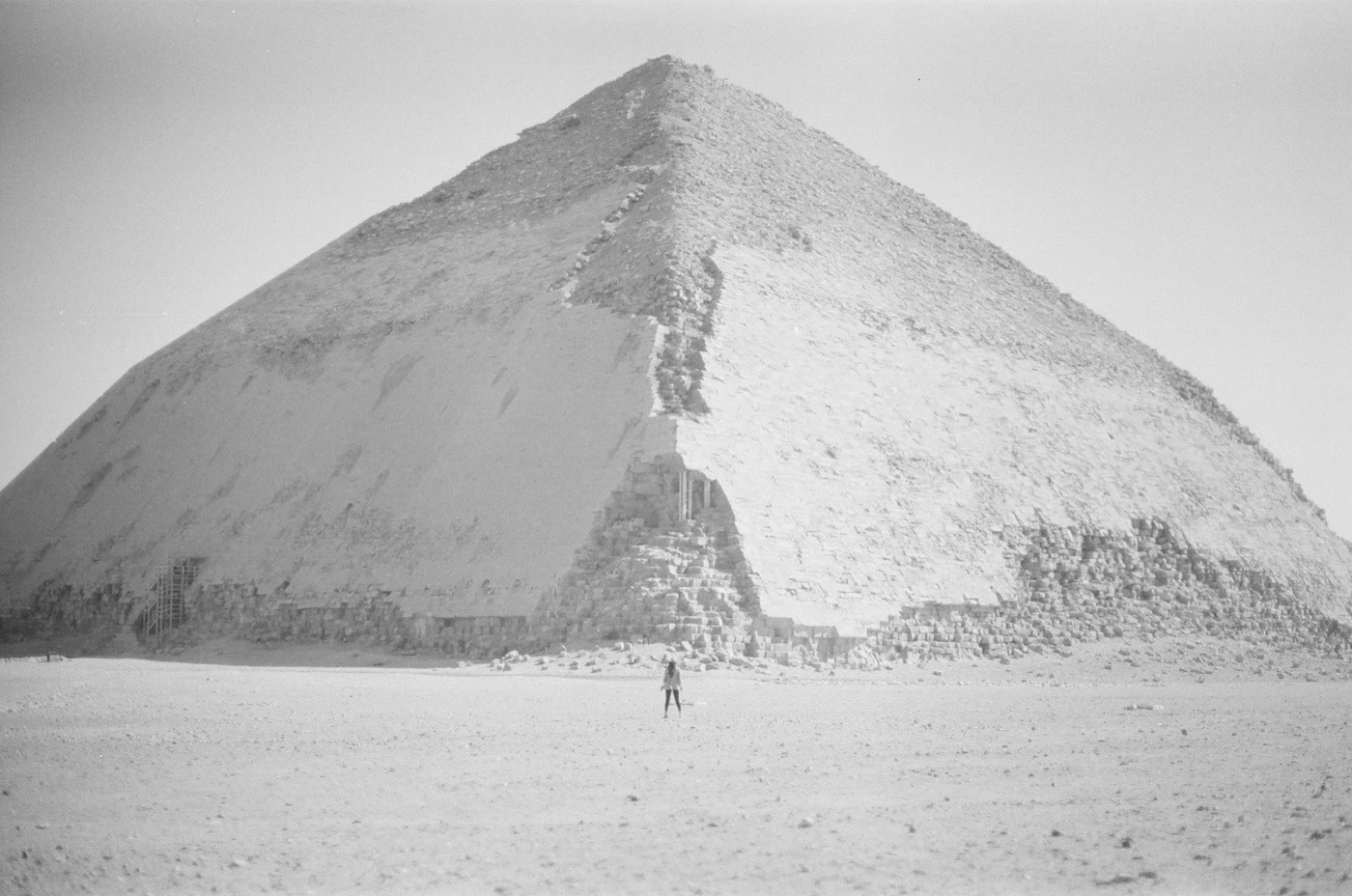 A lone figure in the sand below the Bent Pyramid at Dahshur
