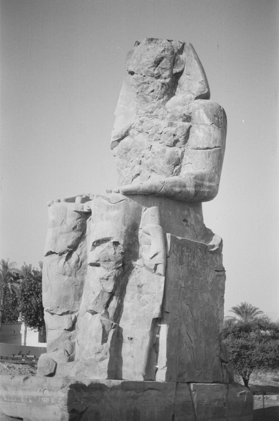 One of the Colossi of Memnon against the morning sky