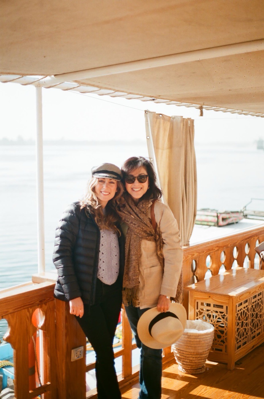 Two travelers on deck as the boat moves down the Nile