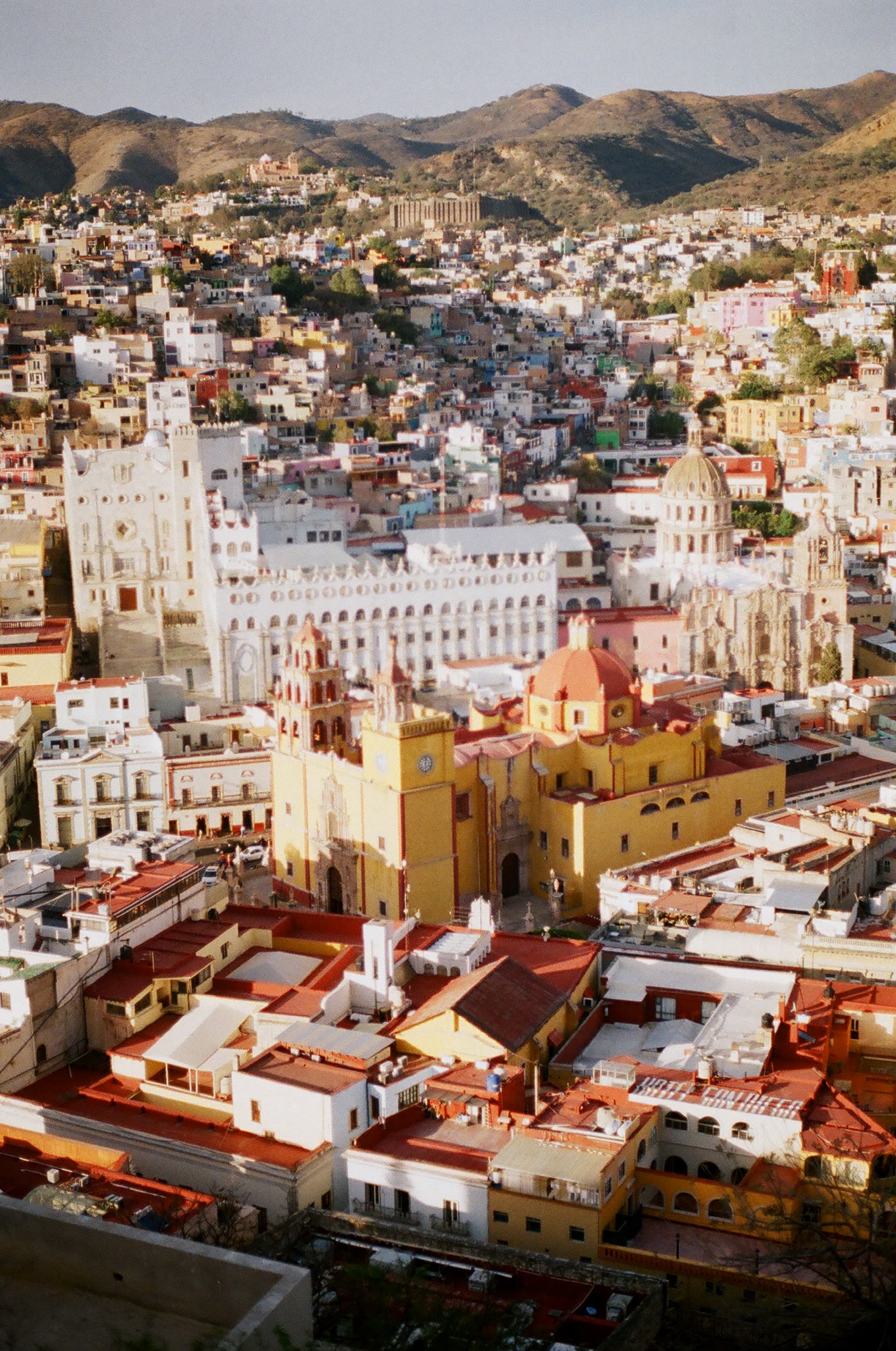 The basilica and the university rising out of the Guanajuato rooftops