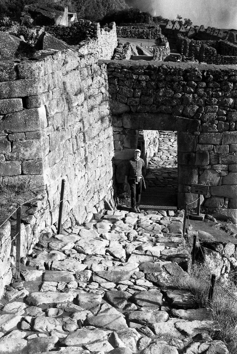 A figure framed in a trapezoidal Inca doorway