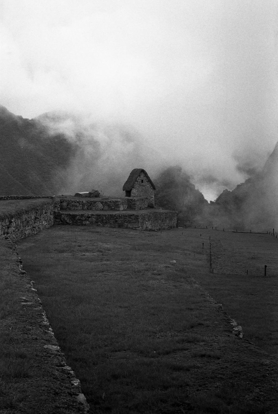 Cloud moving through the stonework of Machu Picchu