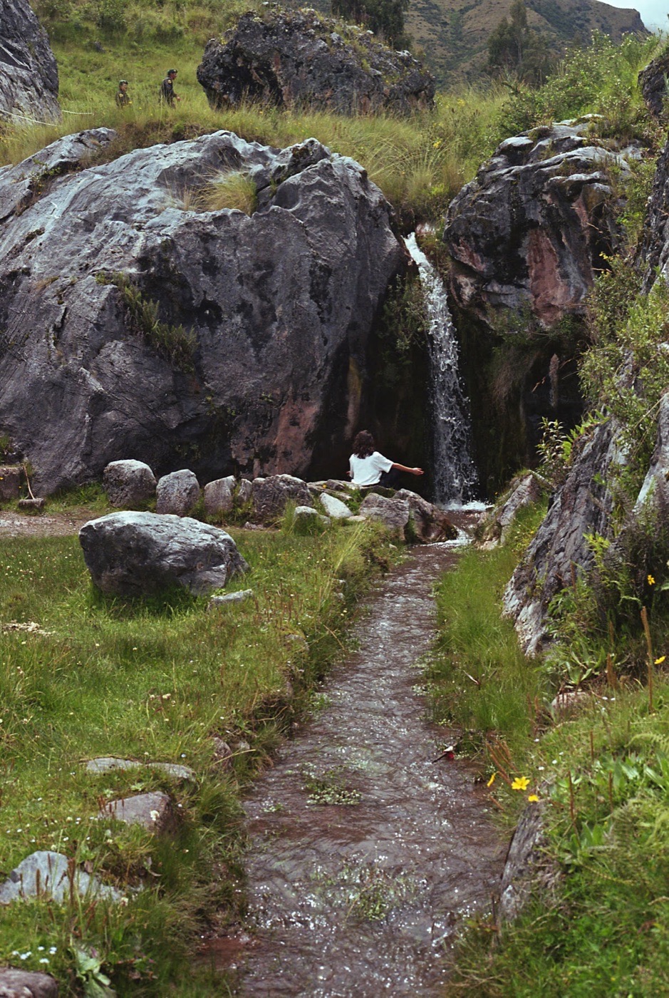 A stone path beside falling water in the high country