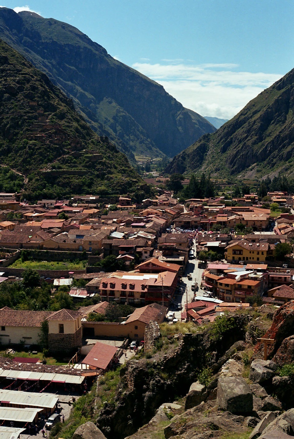 The red roofs of Ollantaytambo below the valley walls
