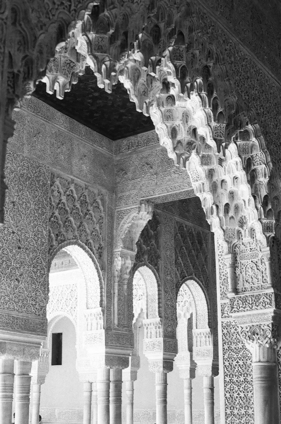 Carved muqarnas and horseshoe arches inside the Nasrid palaces of the Alhambra