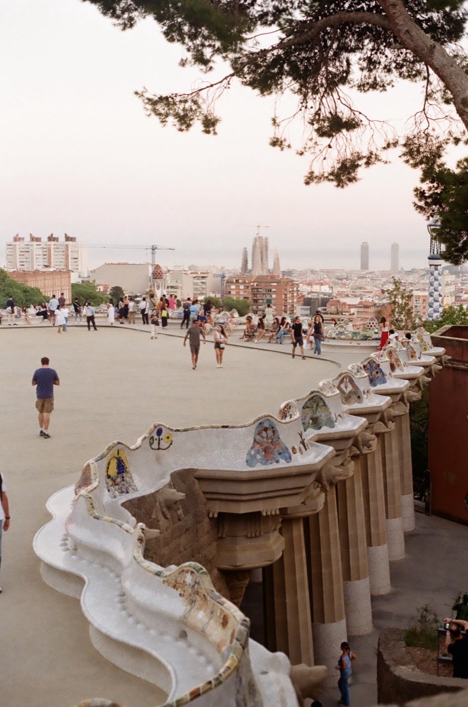 The mosaic serpentine bench at Park G&uuml;ell above the rooftops of Barcelona